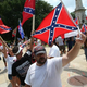 Demonstrators protest at the South Carolina Statehouse June 27, 2015, in Columbia, S.C., calling for the Confederate flag to remain on Statehouse grounds.
Win McNamee/Getty Images